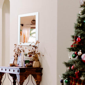 Ruomeng mirror showcased in living room setup for brighter, open space feel.
