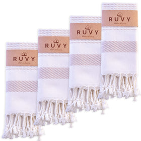 Ruvy Turkish cotton hand towels folded in beige for soft, quick-drying bath use.