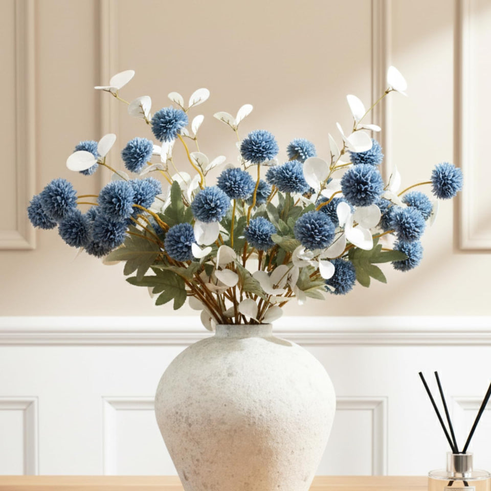 RyddeligHome dusty blue flowers on branches ideal for sophisticated centerpieces.