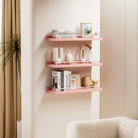 RYOFOBETTO pink and white floating shelves in kitchen hold jars and spice bottles.