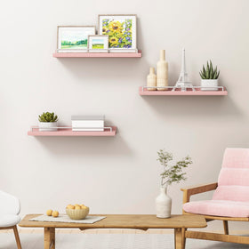 RYOFOBETTO pink and white floating shelves showcasing picture frames and keepsakes.