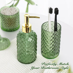 RYTOXILO q-tip holder in olive glass complements decor while organizing cotton swabs.