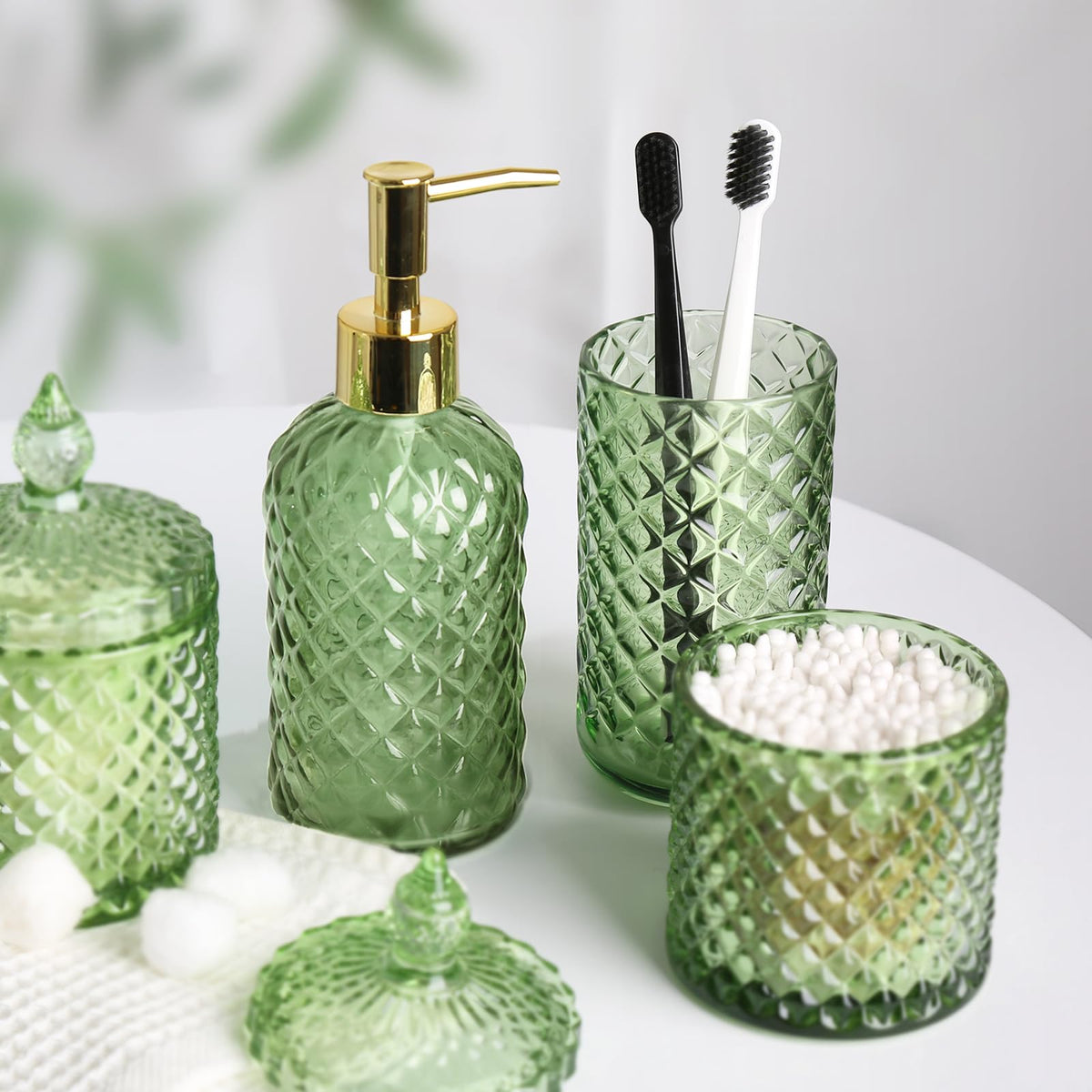 RYTOXILO green glass accents elevate the sink area with cohesive styling.