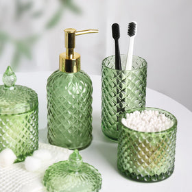 RYTOXILO green glass accents elevate the sink area with cohesive styling.