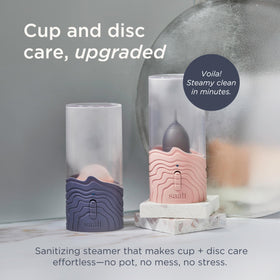 Saalt steamer in action emitting steam to sanitize cups and discs.