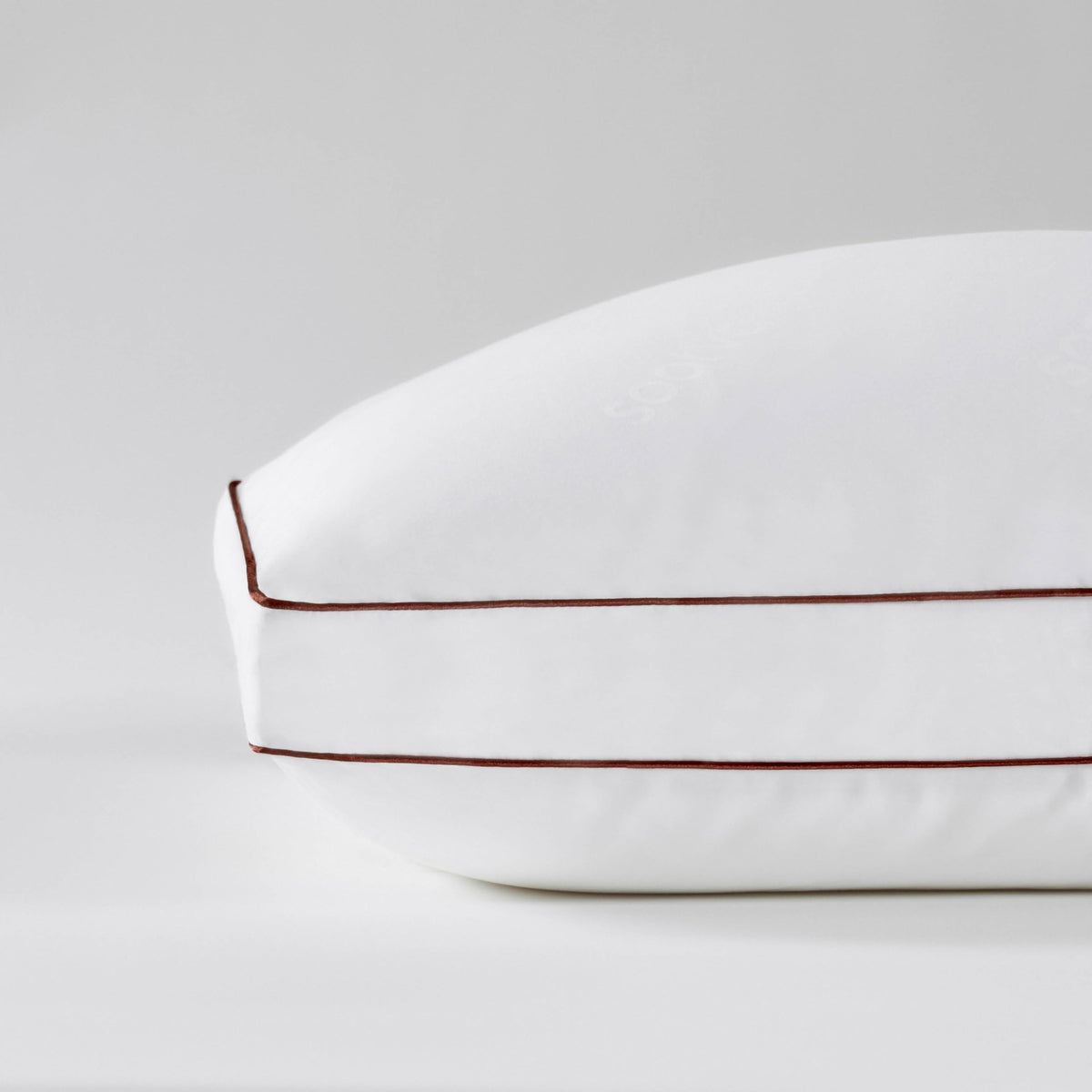 Saatva latex pillow shredded core visible for durable neck support.