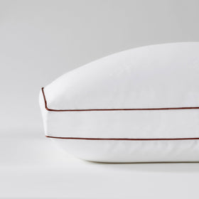Saatva latex pillow shredded core visible for durable neck support.
