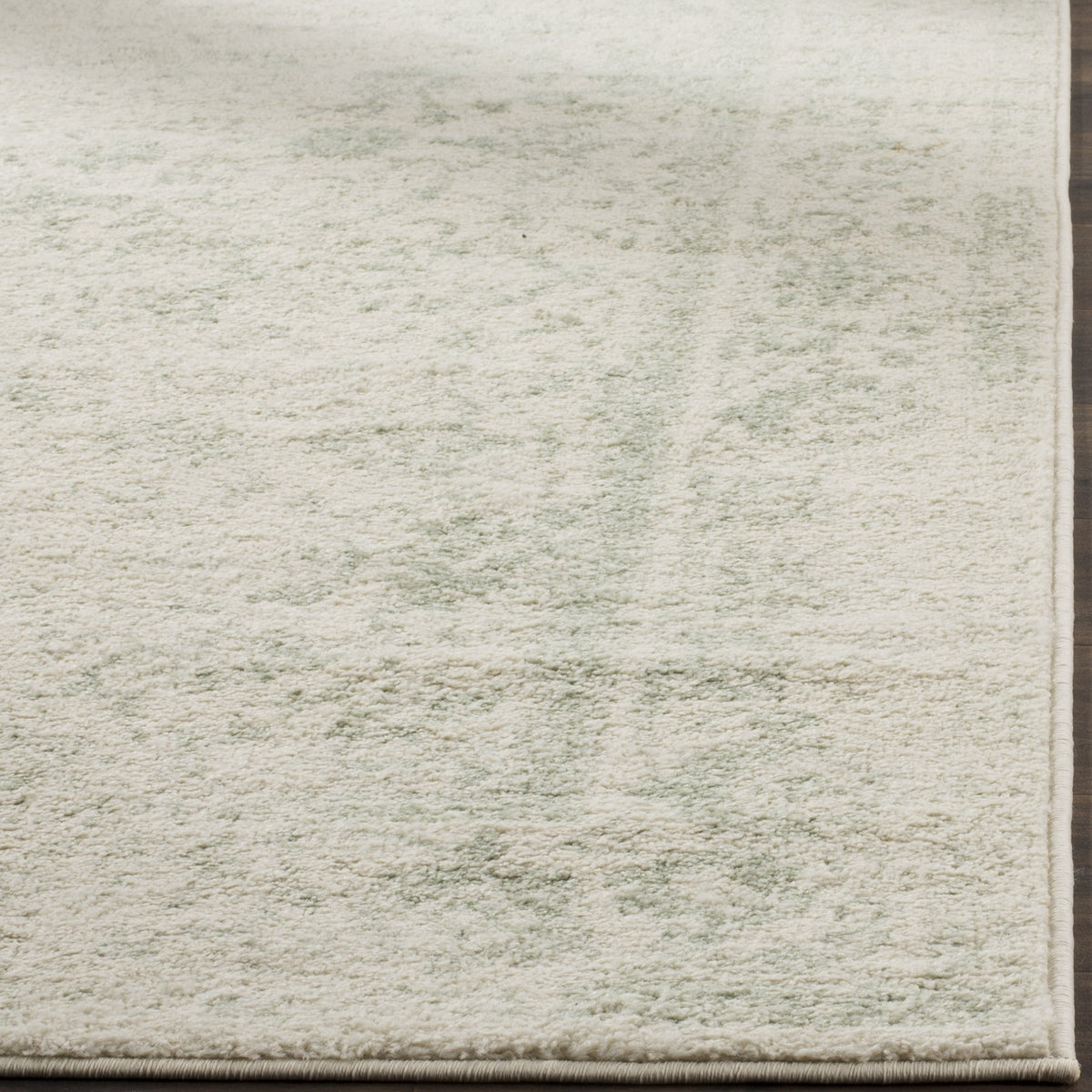 SAFAVIEH Adirondack distressed floral room scene showcases versatile style for living spaces.