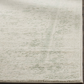 SAFAVIEH Adirondack distressed floral room scene showcases versatile style for living spaces.