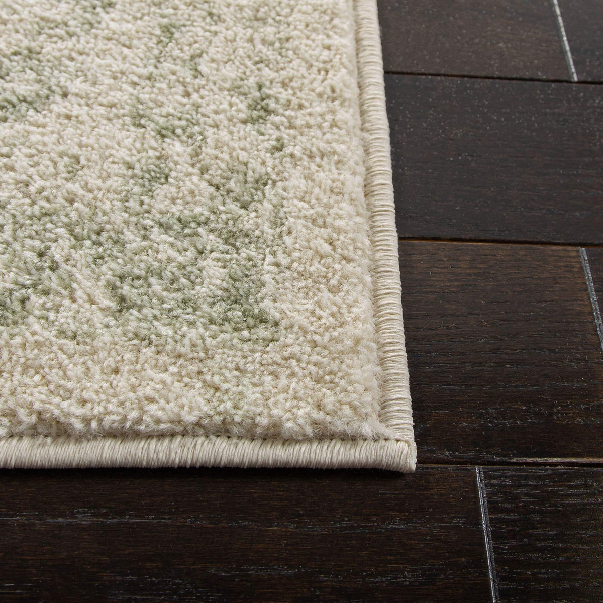 SAFAVIEH Adirondack living room ambience adds warmth with ivory and sage tones.