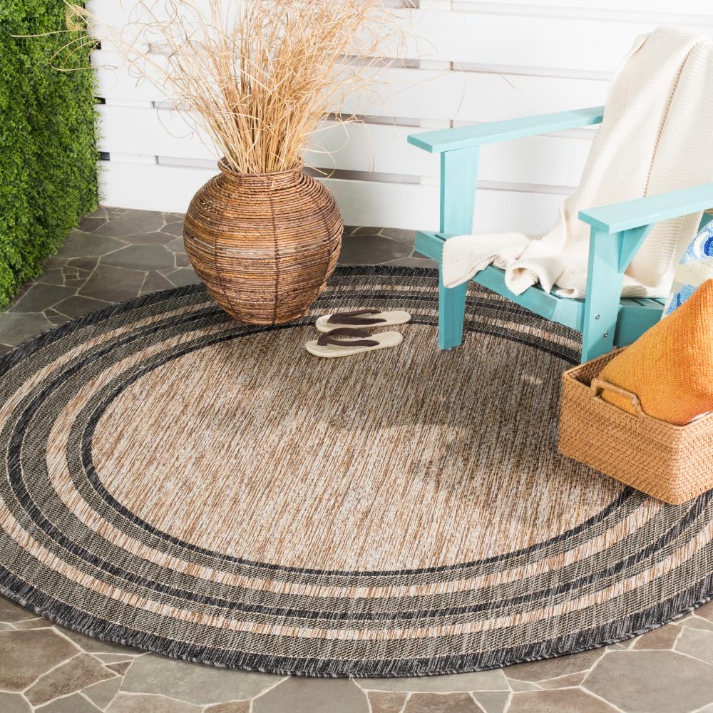 Safavieh Courtyard round rug in natural and black for patio ambiance and easy maintenance.