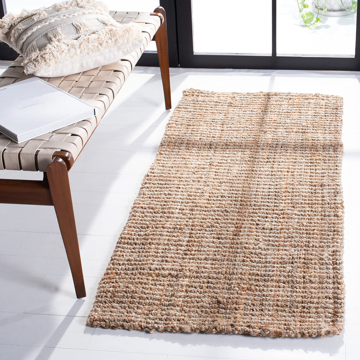 SAFAVIEH handmade jute rug closeup texture in natural brown for warm living spaces