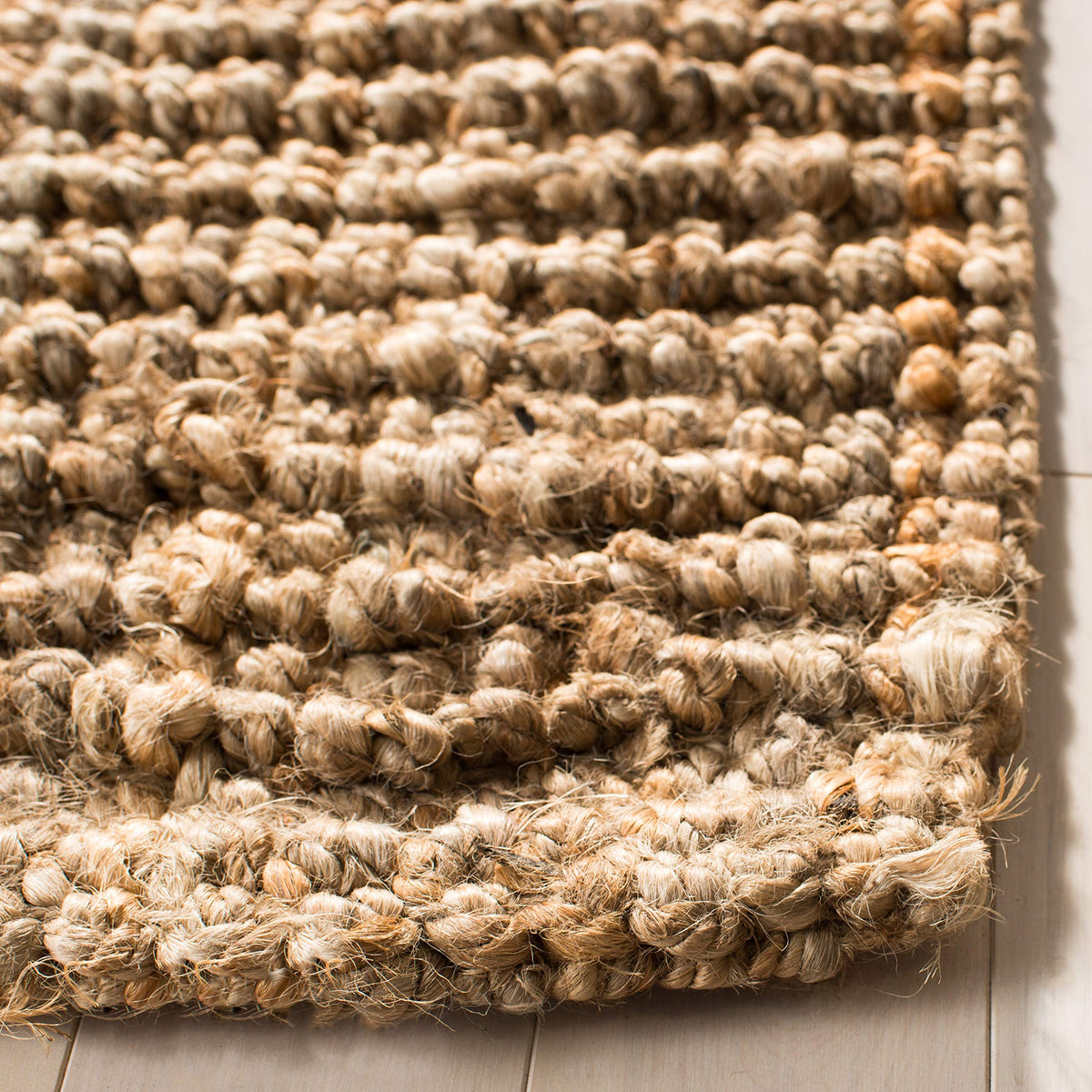 SAFAVIEH handmade jute rug visible weave in a wide shot for earthy durability