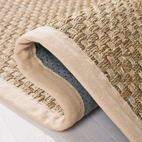 Safavieh NF114A felt-dotted backing offers grip and stability on floors.