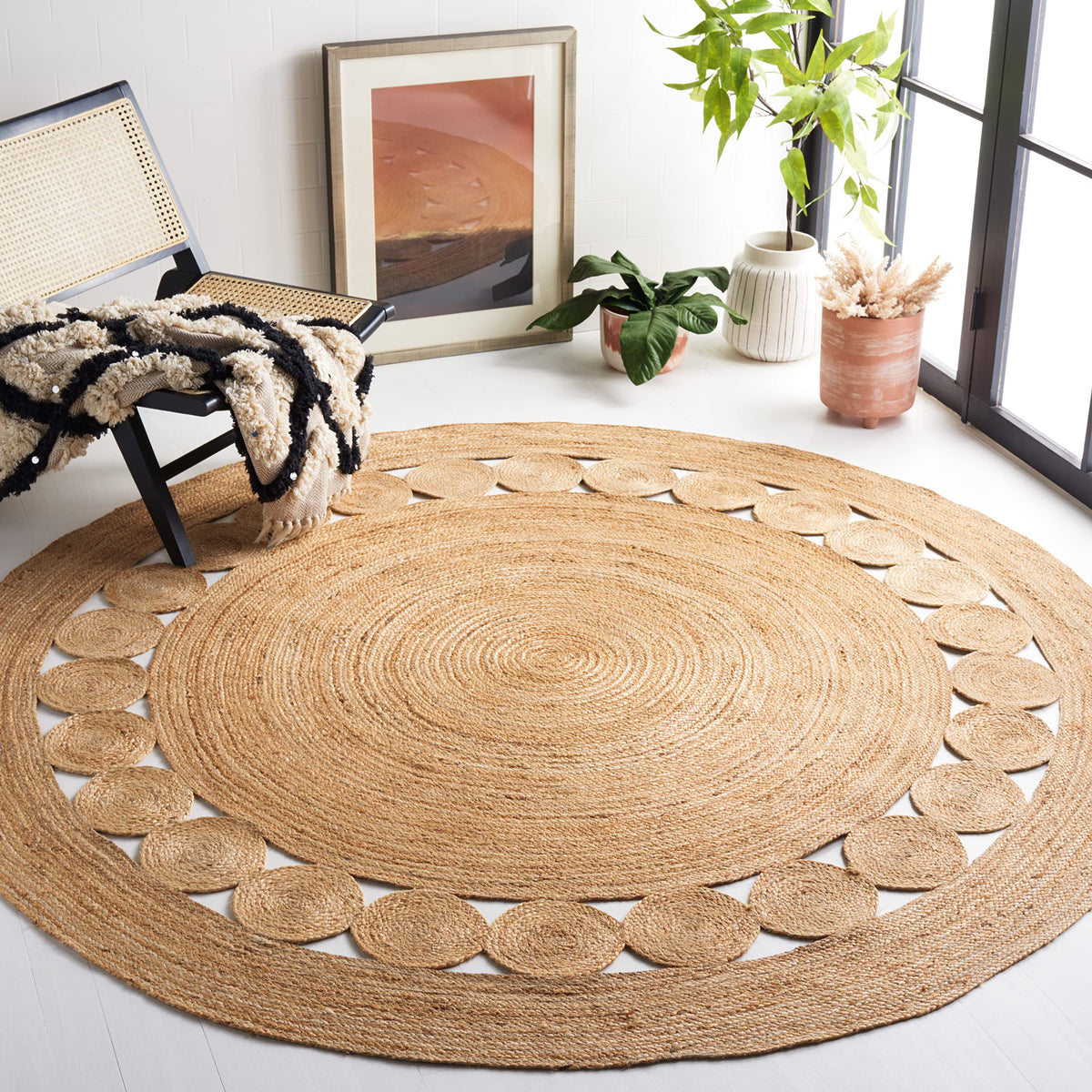 SAFAVIEH round natural fiber jute rug with braided design, ideal for cozy living spaces