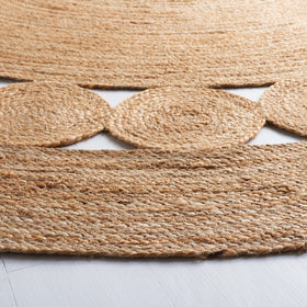 SAFAVIEH round jute rug closeup highlights texture and natural variations for boho charm
