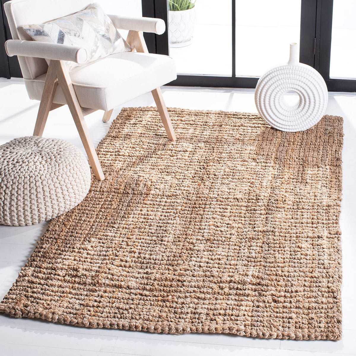 SAFAVIEH natural fiber rug top view in brown defines cozy seating areas
