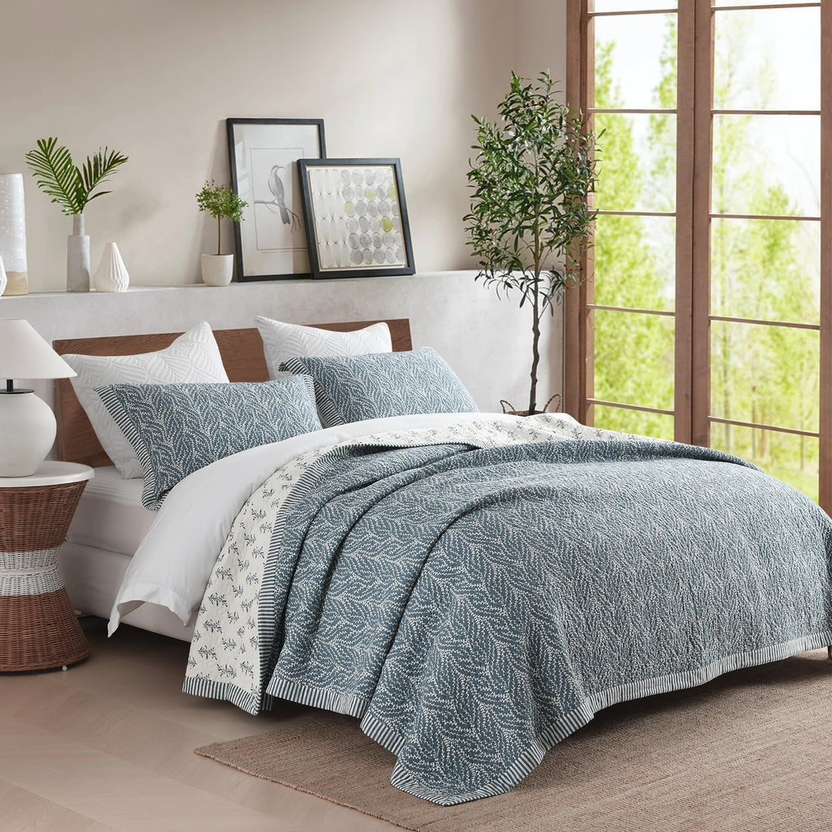 SahSahCasa king pillow shams match the botanical quilt theme.