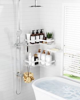 Sakugi Corner Shower Caddy with adhesive tapes for drill-free wall mounting.