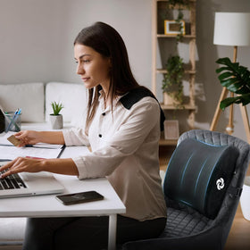 Samsonite memory foam pillow inside car interior with plush layer for comfort.