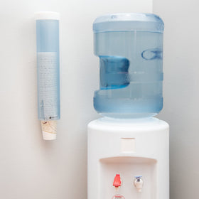 Flip-cap mechanism of San Jamar dispenser protects cups during refilling.