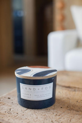 Sand + Fog coastal decor candle with lid art to elevate any space.
