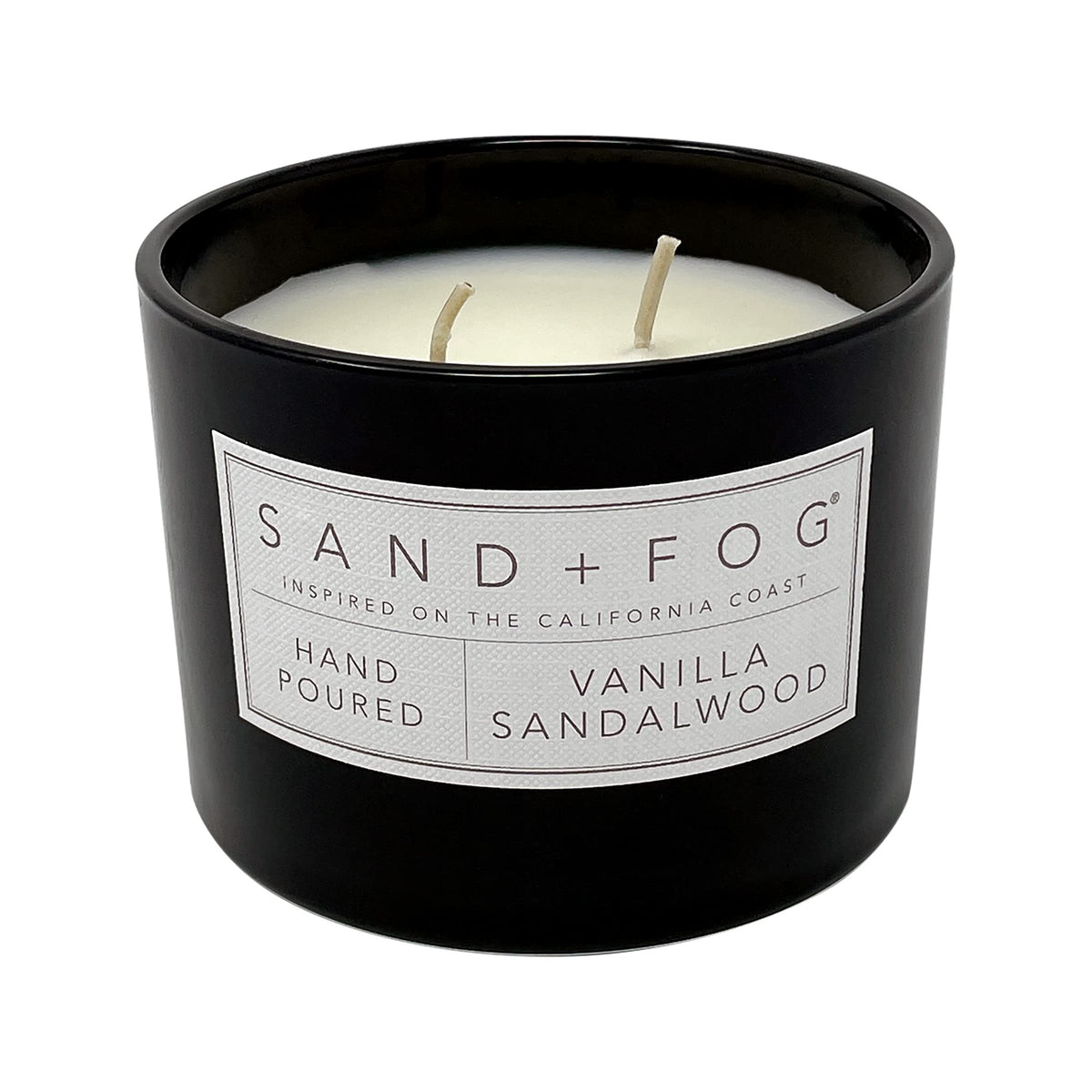 Sand + Fog Vanilla Sandalwood candle glass closeup highlights elegant vessel.