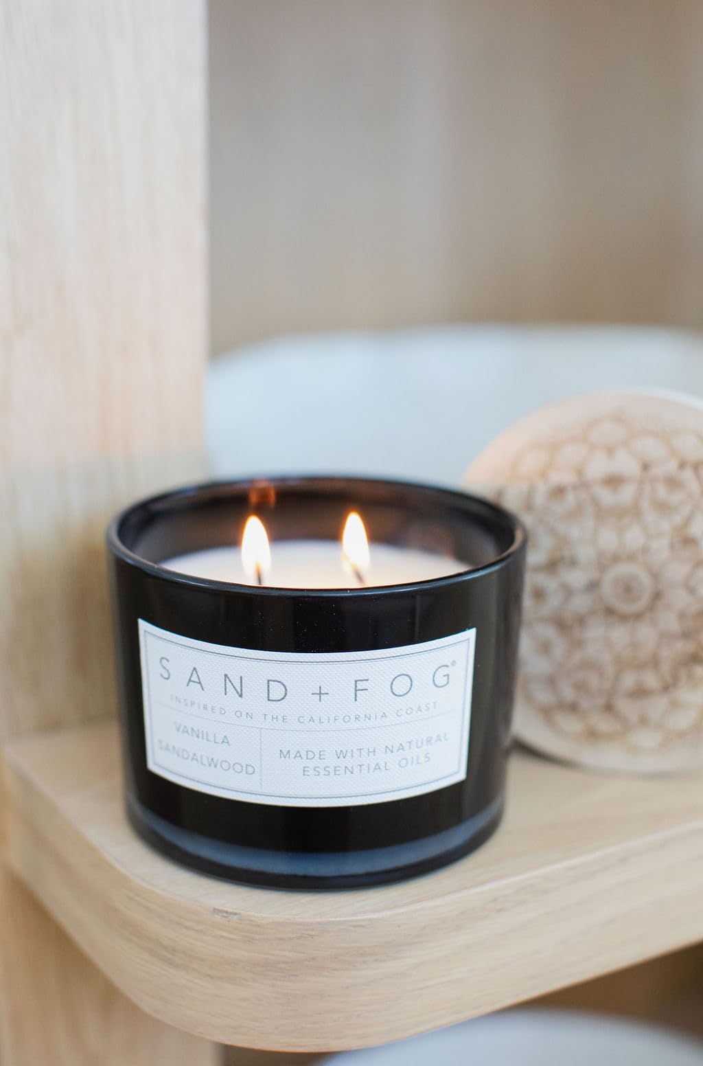 Sand + Fog Vanilla Sandalwood candle label design enhances display.