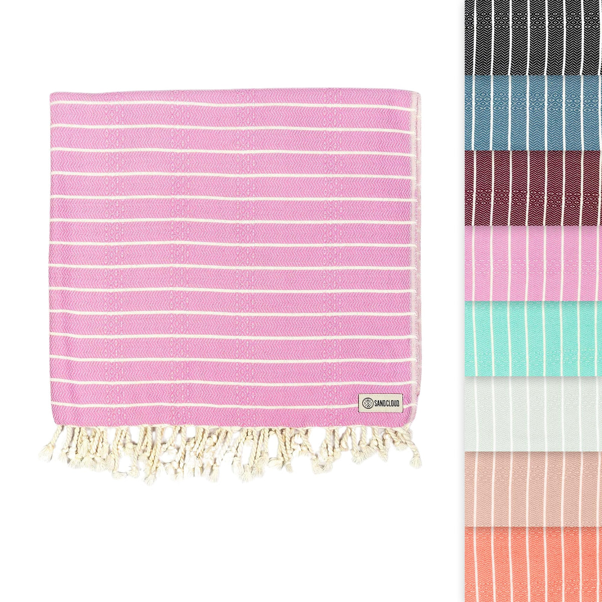 Sand Cloud Gocek Pink towel folded for easy packing and quick drying.