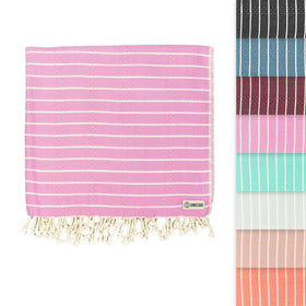 Sand Cloud Gocek Pink towel folded for easy packing and quick drying.