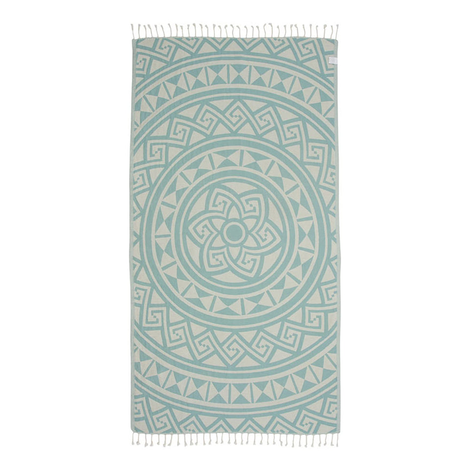 Sand Cloud Turkish Beach Towel Mandala Mint, rolled for easy packing.