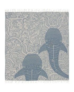 Sand Cloud Whale XL towel folded, compact and travel-ready for easy beach days.