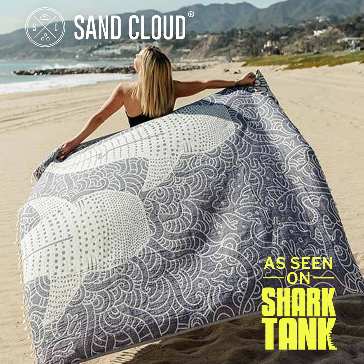 Sand Cloud Whale XL towel rolled in bag for fast-drying, on-the-go use.