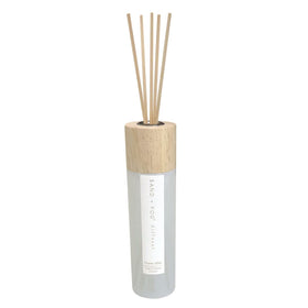Sand + Fog Ocean Mist diffuser bottle releasing vibrant essential oils for calming ambiance