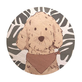 Decorative lid artwork on a Sand + Paws candle adds style to any room.