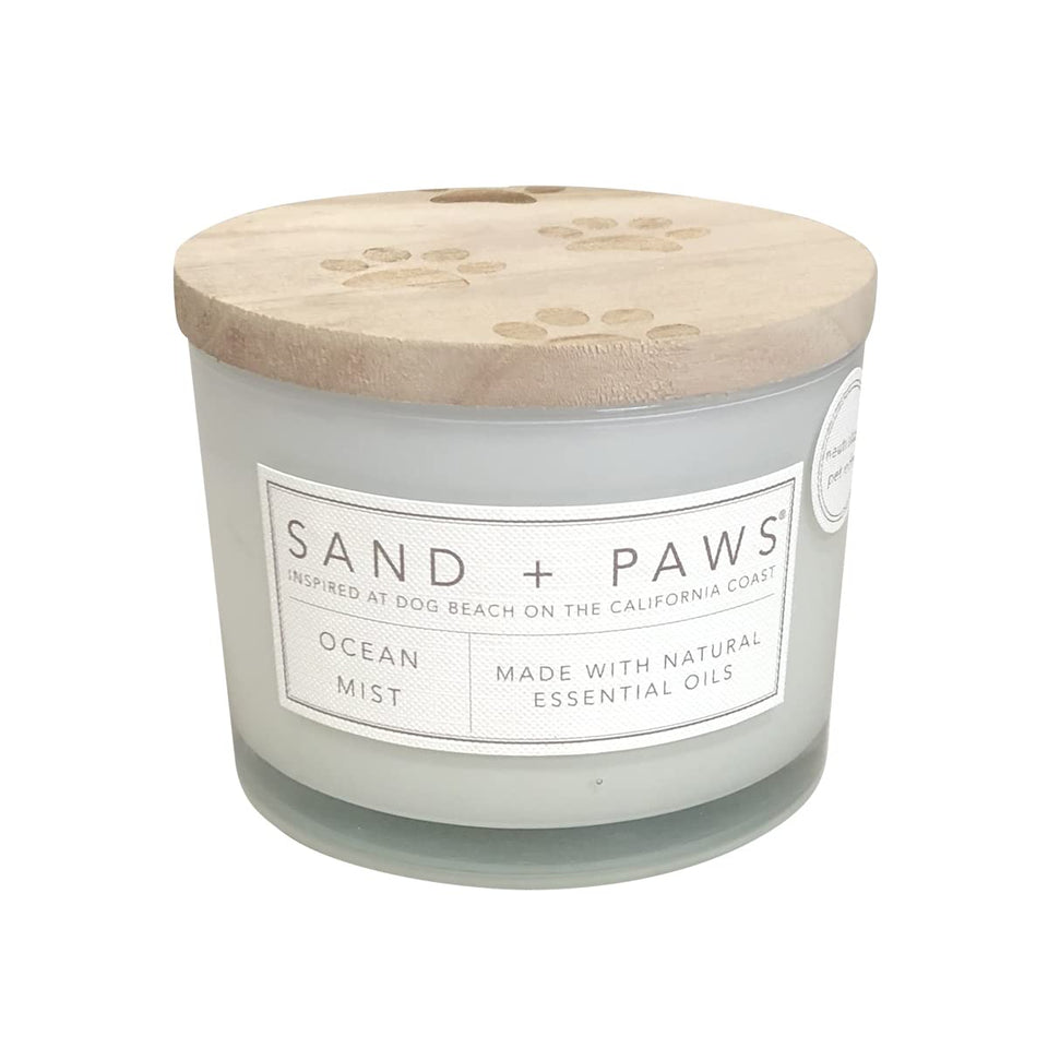 Sand + Paws Ocean Mist candle jar showing its clean burn and odor control benefits.