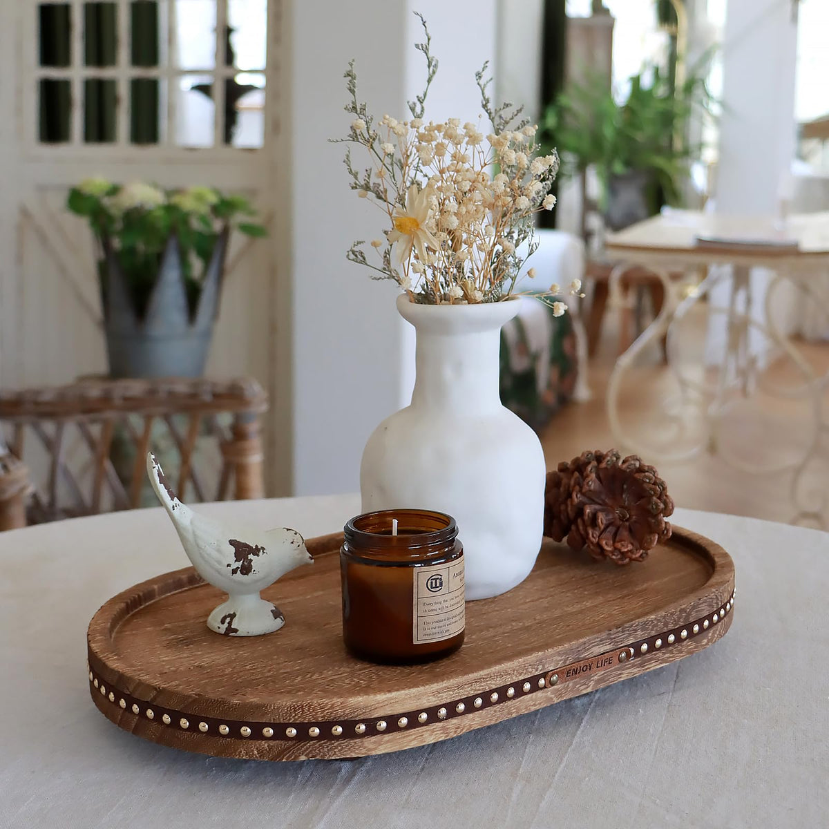 SAOCAIHUL round tray holding candles or cosmetics in a bedroom setup.