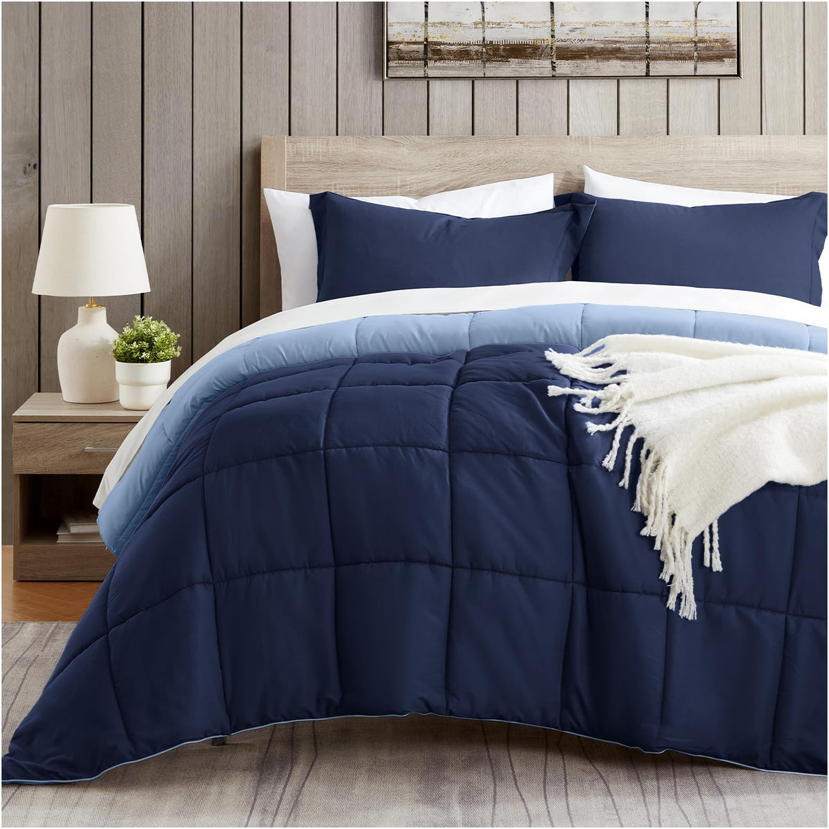 Satisomnia Queen Comforter Navy Blue on bed for year-round softness