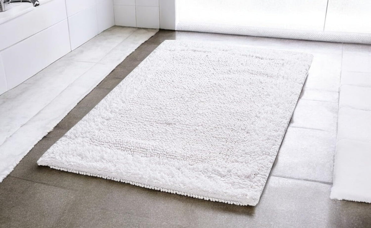 Savi Home 100% cotton bath rug with high absorbency.