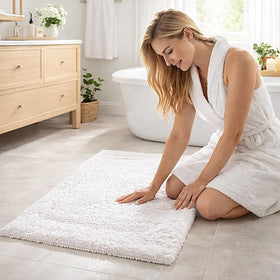 Savi Home absorbent white bath mat for quick moisture pickup.
