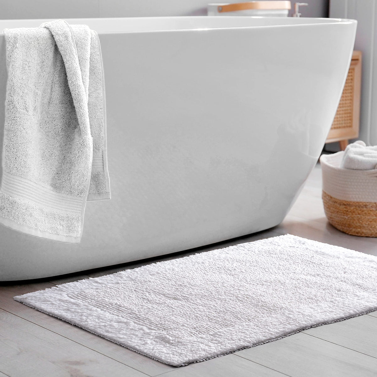 Savi Home hand-tufted bath mat delivers plush comfort on bare feet.