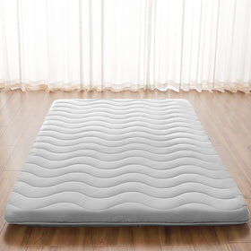 SCHNAUZER HOME Japanese floor mattress folded compactly for easy storage and transport.