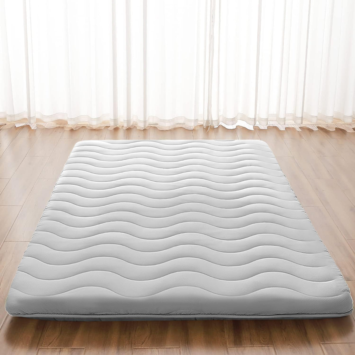 Schnauzer Home Japanese Futon mattress close-up shows foam-core support for the floor.