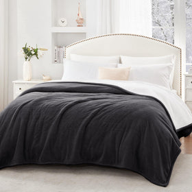 Sealy twin blanket draped on a couch for cozy home use