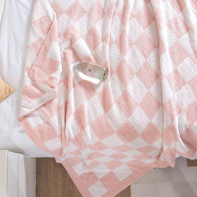 SeaRoomy pink checkered throw blanket styled for photoshoot setup