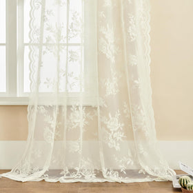 SEEKRIGHT ivory lace curtains with scalloped edges add vintage charm.