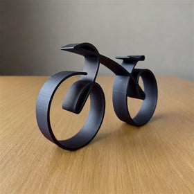 SENIDIKE bicycle sculpture on shelf, compact design fits small spaces beautifully.