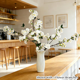 Senjie seasonal table decor using cherry blossom branches for color and texture