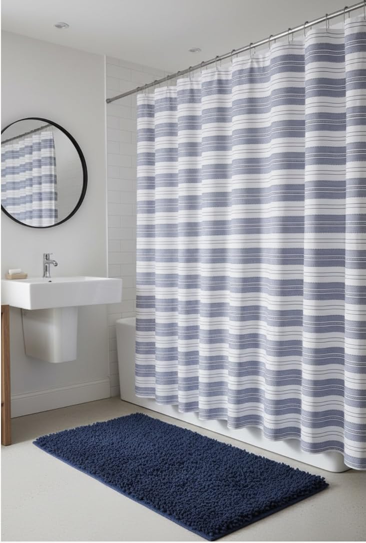 Serafina Home blue and white stripe texture enhancing coastal bathroom aesthetics.