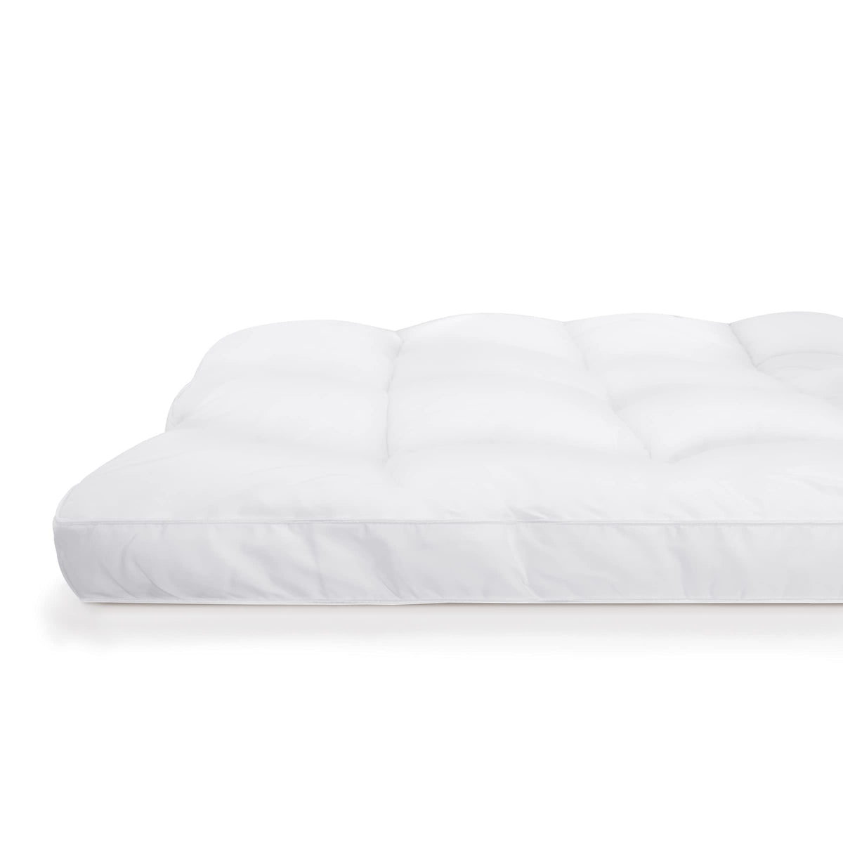 Serta Down Illusion king topper on bed demonstrates added cushioning.
